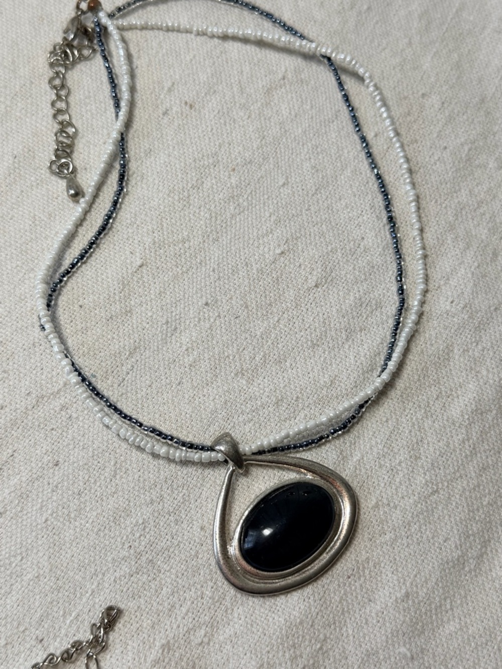 Elegant Silver Pendant Necklace with Black Stone and White Beaded Strands